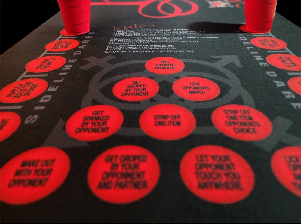 DV8 Dare Pong Game Nominated Adult Game of the year shown are dare pong table red circles with challenging adult dares that encourage interaction and breaks the ice with swingers and curious adults 